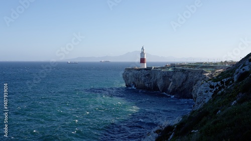 Europa Point Lighthouse guiding ships near Gibraltar, United Kingdom, with Morocco in the background