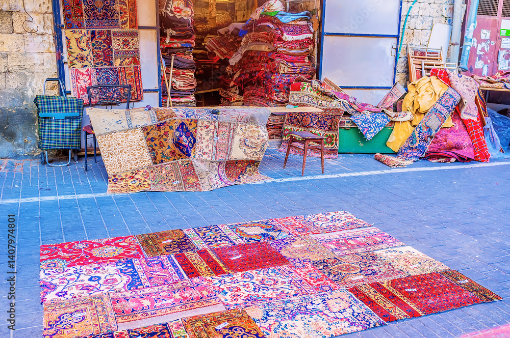The patchwork rugs in a rug stall of Jaffa flea market, Tel Aviv, Israel