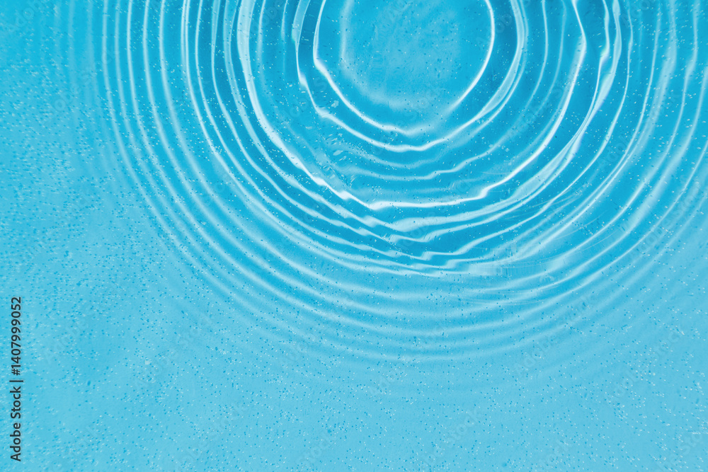 drops on water with circles on a blue background