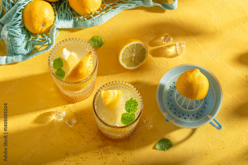 Homemade lemonade or mojito cocktail with citrus and mint.