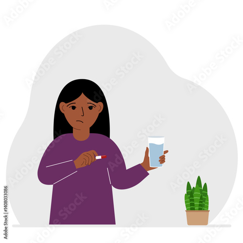 A little girl in one hand holds medicine or a pill in another glass of water. The concept of taking medicine to treat diseases, taking vitamins or food supplements with water.