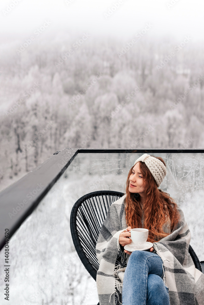 Woman Drinking Tea on House Terrace in Winter