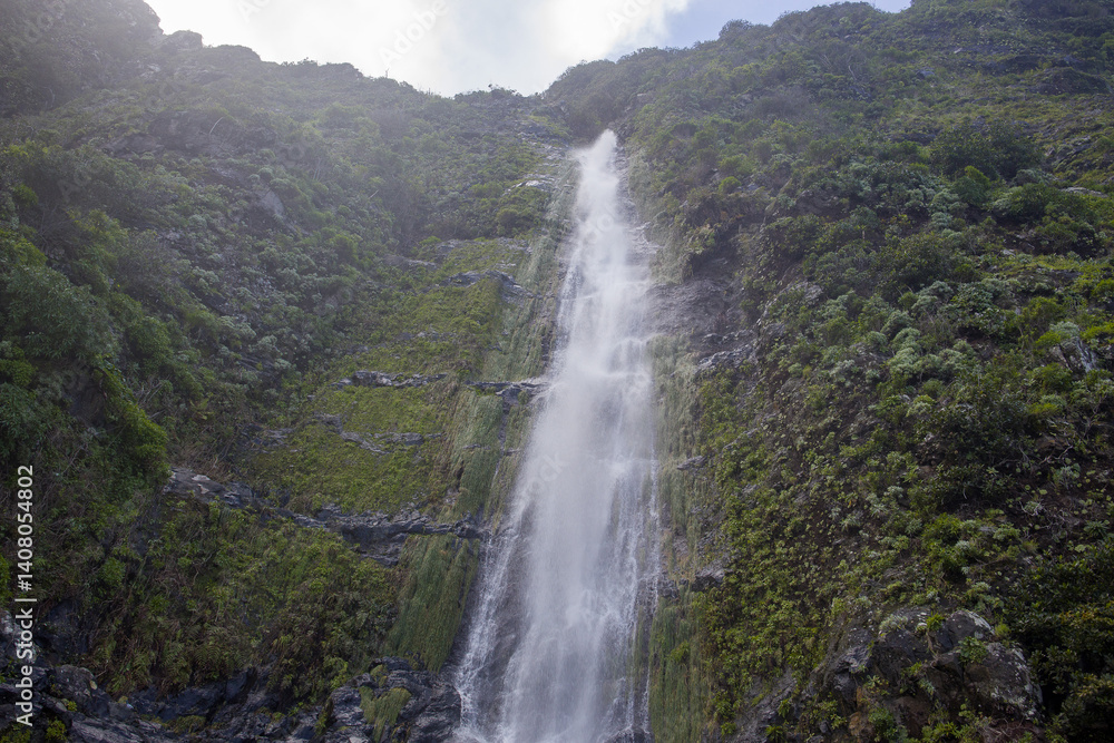 Majestic Madeira Agua d'Alto waterfall cascading down lush cliffs in a serene natural setting