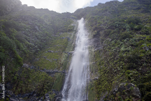 Majestic Madeira Agua d'Alto waterfall cascading down lush cliffs in a serene natural setting