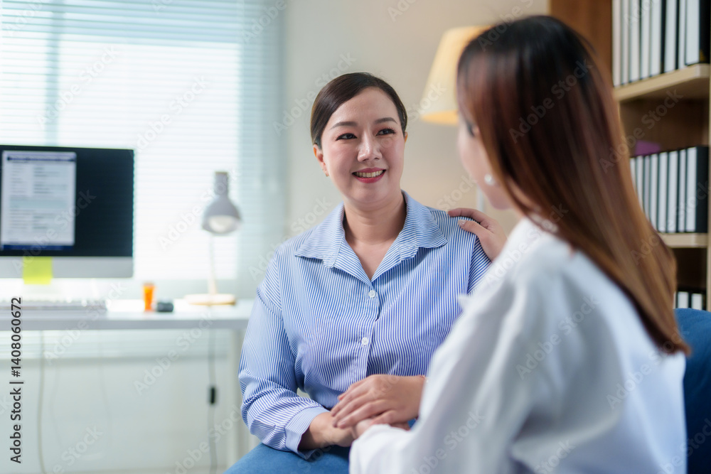 Asian female doctor is supporting and comforting her patient during a medical consultation in a clinic Asian female doctor is supporting and comforting her patient during a medical consultation in a clinic