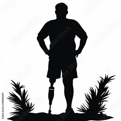 Silhouette of man with prosthetic leg standing outdoors