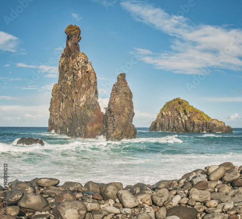 Miradouro Ilheus da Ribeira da Janela, Madeira, Island, Portugal: Ocean waves crash against rocky islands under a blue sky