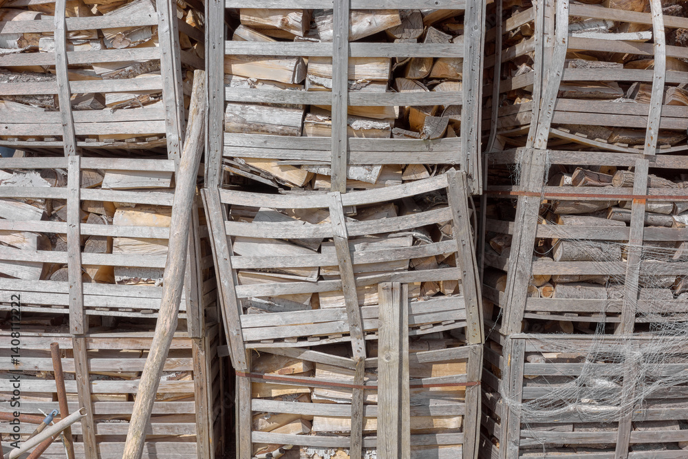 Wooden crates containing chopped firewood. Wooden crates containing chopped firewood.