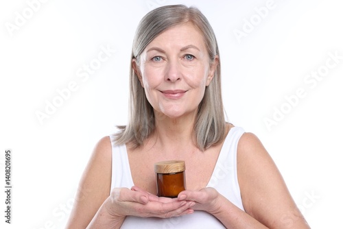 Obraz na płótnie Woman with jar of collagen cream on white background w salonie