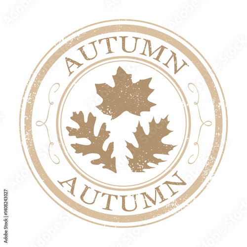 A grunge circle stamp with leaves and autumn text
