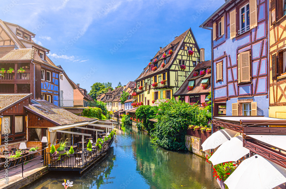 Little Venice la Petite Venise in old town Colmar city historic centre with old colorful houses medieval buildings on bank of river Lauch canal in summer day, Alsace Grand Est region, France Little Venice la Petite Venise in old town Colmar city historic centre with old colorful houses medieval buildings on bank of river Lauch canal in summer day, Alsace Grand Est region, France