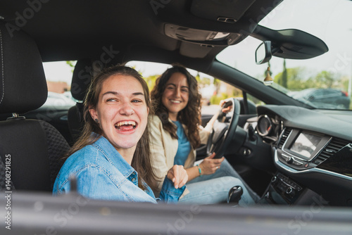 Quadro em tela Young woman with cerebral palsy and assistant sharing joyful moment in car - Bot