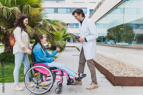 Tableau sur toile Young woman with cerebral palsy smiles during outdoor visit with her caregiver and doctor - Concept of cerebral palsy and inclusive healthcare