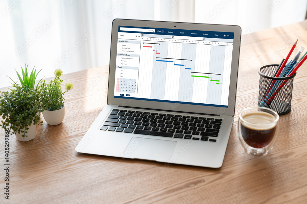 Fototapeta premium Project planning software for modish business project management on the computer screen showing timeline chart of the team project