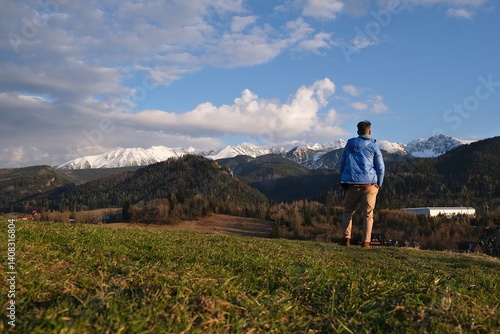 Obraz na płótnie Silhouette of standing man in blue jacket on beautiful viewpoint with Tatras mountains on Antalowka, Zakopane, Poland w salonie