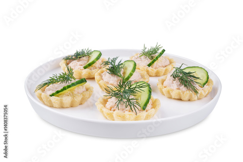 Salmon mousse tartlets in a plate on a white isolated background
