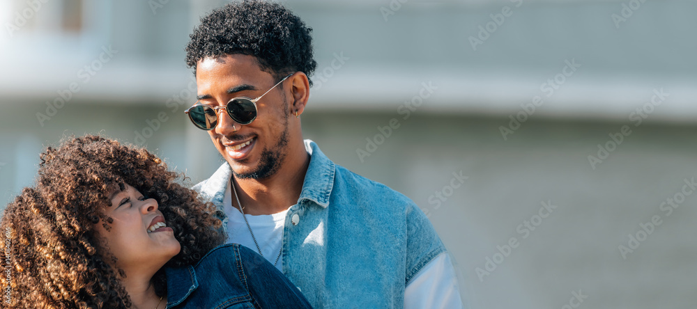 romantic latin couple hugging happily outdoors