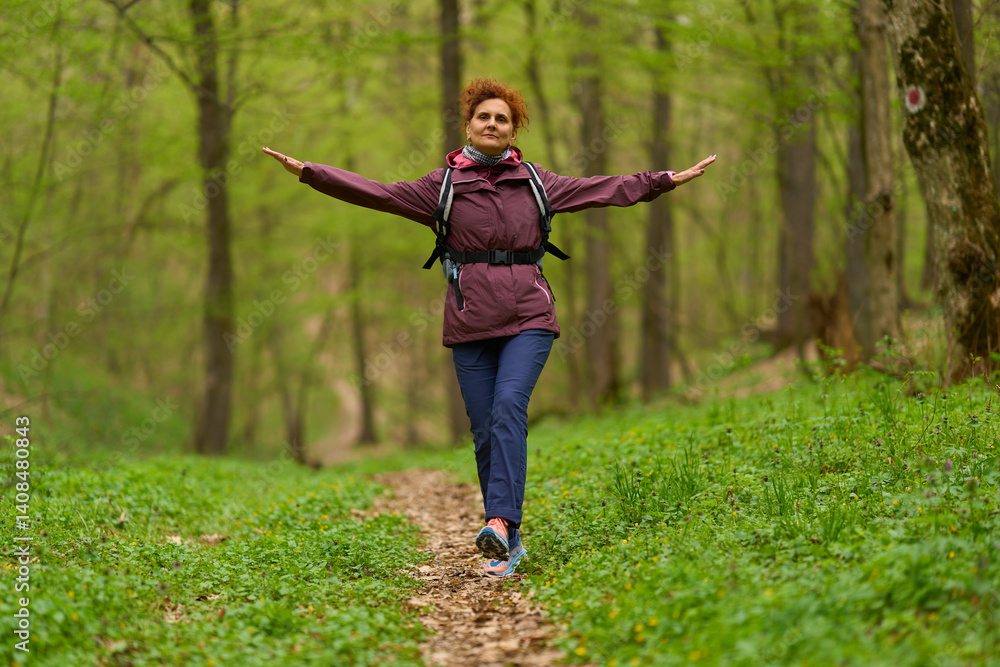 Woman jumping joyfully in forest