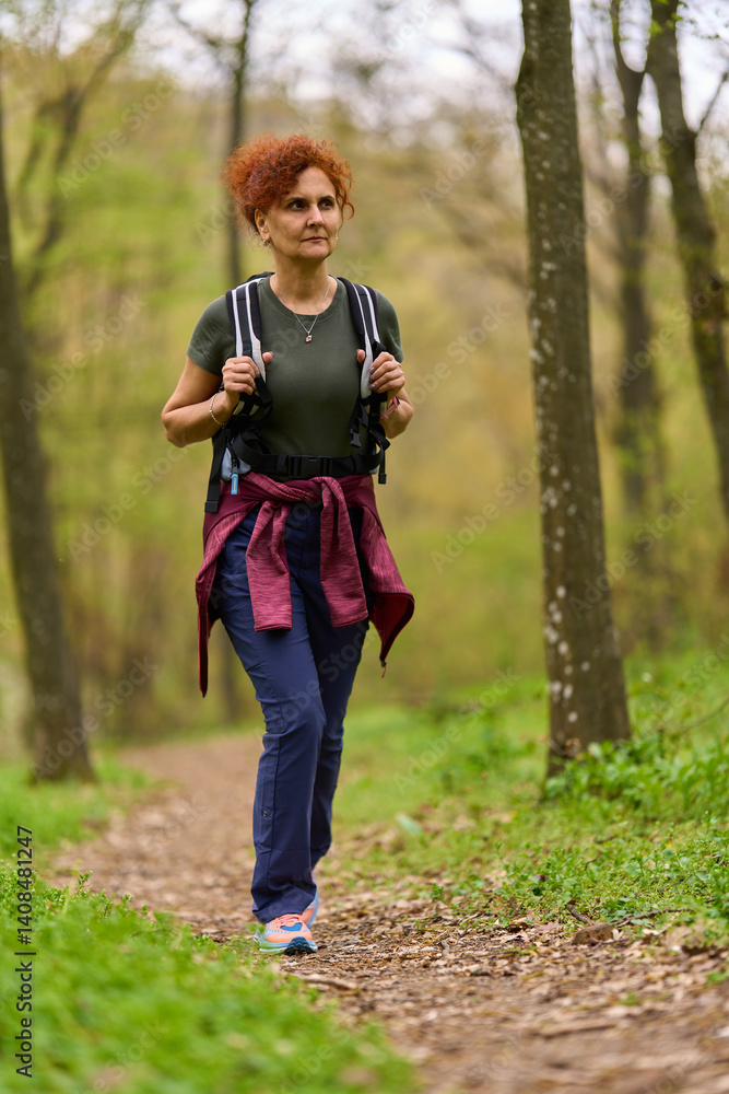 Woman hiking in spring forest