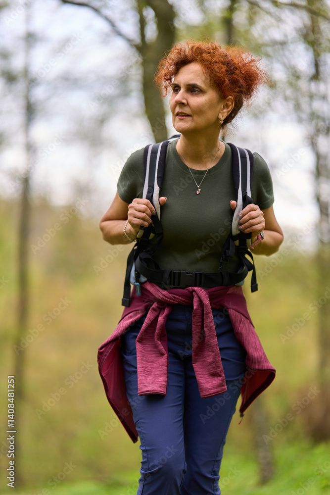 Woman hiking in spring forest