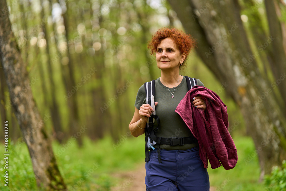 Woman hiking in spring forest