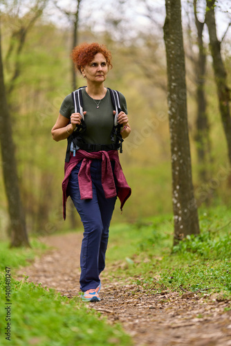 Obraz na płótnie Woman hiking in spring forest w salonie