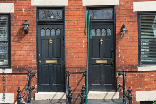 Принти на полотні Doorway with two doors with porch in a red brick house.