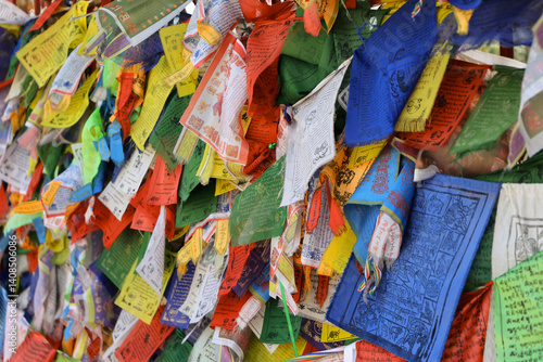 Close Up Of Numerous Colorful Tibetan Buddhist Prayer Flags (Lung Ta) Hanging And Fluttering, Covered With Mantras And Symbols. Religious Background.