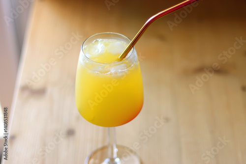 Plate with two watermelon slices and glass of orange juice on the table. Selective focus.
