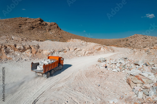 Truck carrying raw stuff at mining quarry