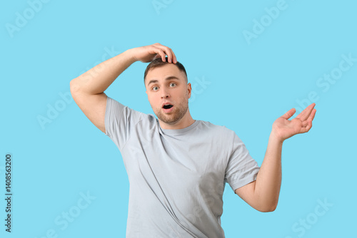Shocked young man with hair...