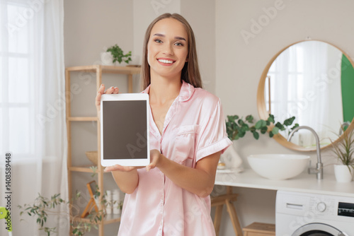 Young woman with tablet com...