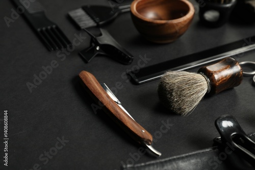 Many different barber's tools on black table, closeup