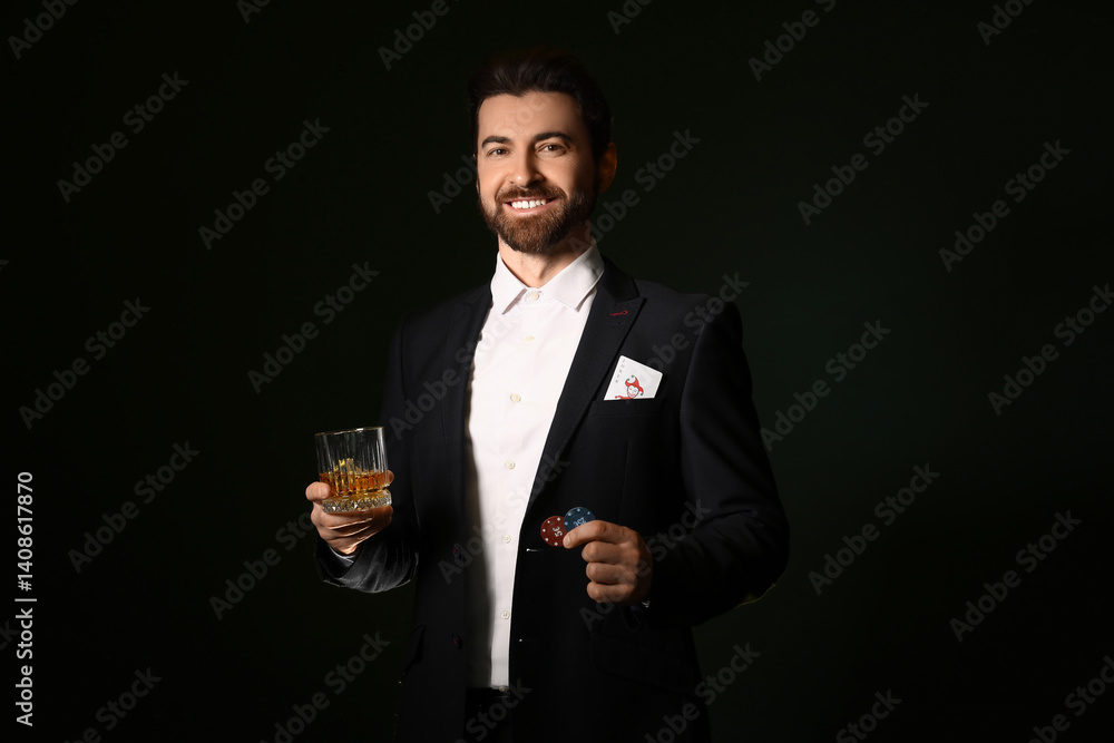 Handsome young man with whiskey and poker chips on dark green background Handsome young man with whiskey and poker chips on dark green background
