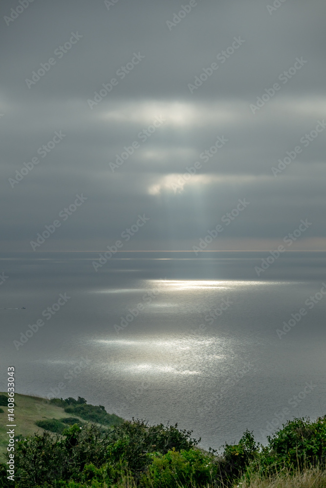 Rays of Sun Break Through Clouds to the Pacific