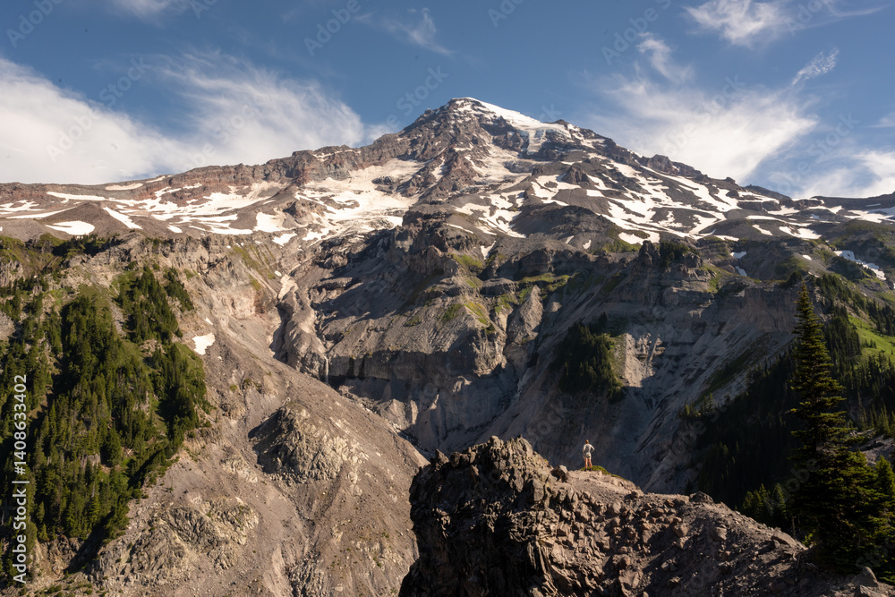 HIker Stand and Looks Out At Mount Rainier From Mildred Point