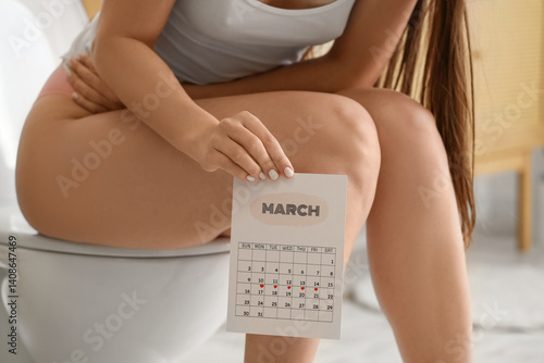 Young woman with menstrual ...