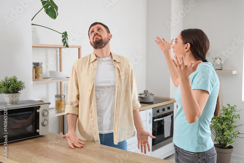 Young woman quarreling with...