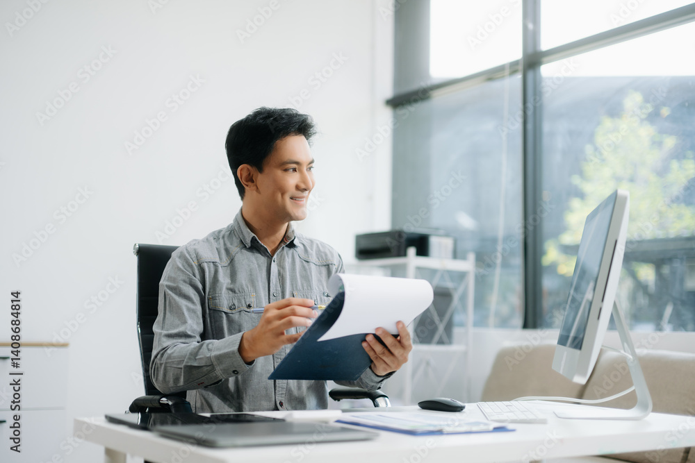 Confident businessman working on finance analysis with a tablet and laptop at office desk. Confident businessman working on finance analysis with a tablet and laptop at office desk.