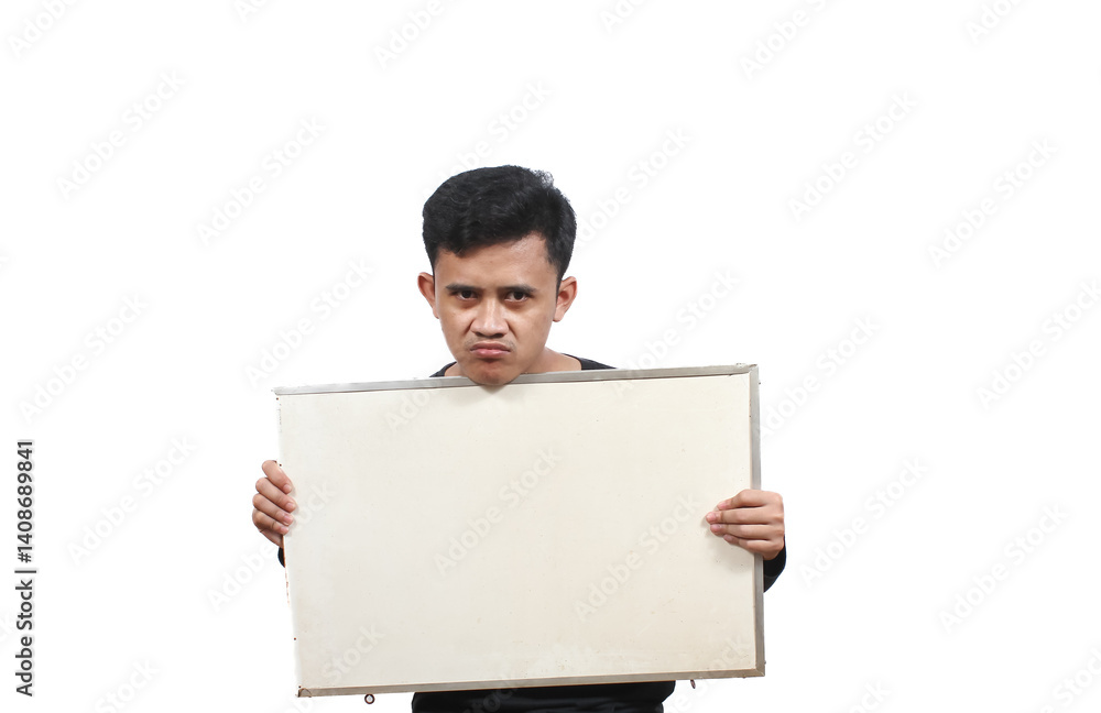 Asian man wearing black t-shirt carrying blank board showing protest sign on white background Asian man wearing black t-shirt carrying blank board showing protest sign on white background