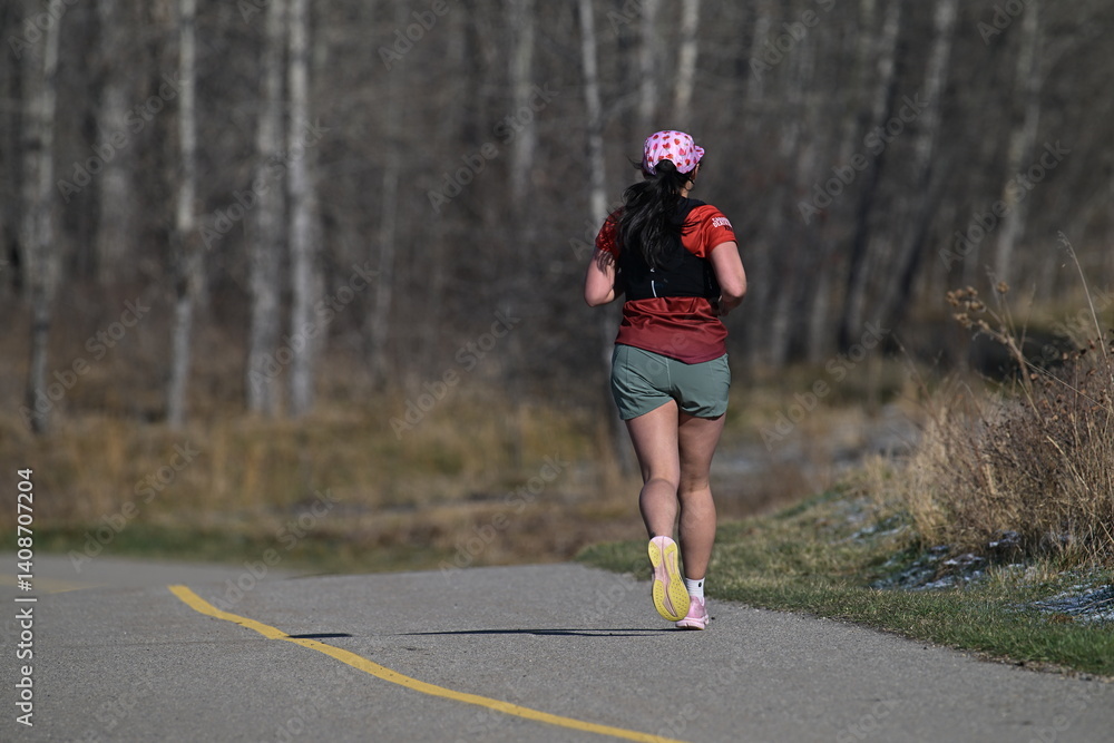 Fototapeta premium young woman running in the park