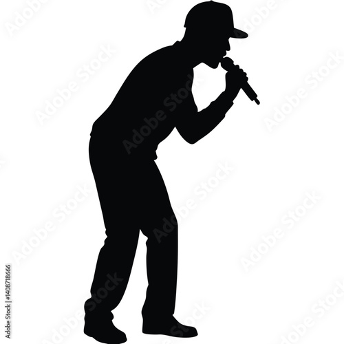 Silhouette of African American man holding microphone while performing on stage
