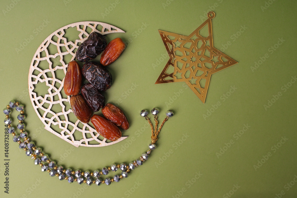Fototapeta premium Dates Fruit Arrange With Islamic Decoration On Sage Background