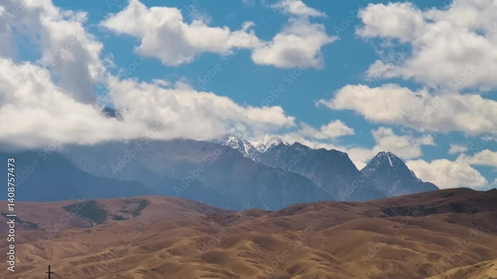 A captivating time-lapse video showing clouds sweeping over a lush valley in Kyrgyzstan, transforming the landscape with ever-changing skies, perfect for nature enthusiasts and photographers. A captivating time-lapse video showing clouds sweeping over a lush valley in Kyrgyzstan, transforming the landscape with ever-changing skies, perfect for nature enthusiasts and photographers.