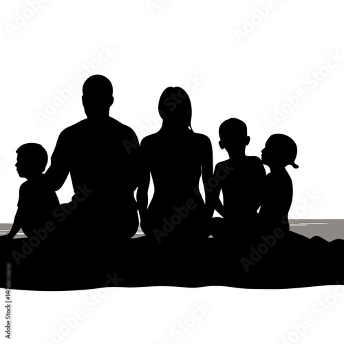 A silhouette of a family sitting on a beach, watching the sunset 