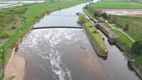 Large river and weir sluice lock system England navigation Trent FPV drone aerial sunset photo