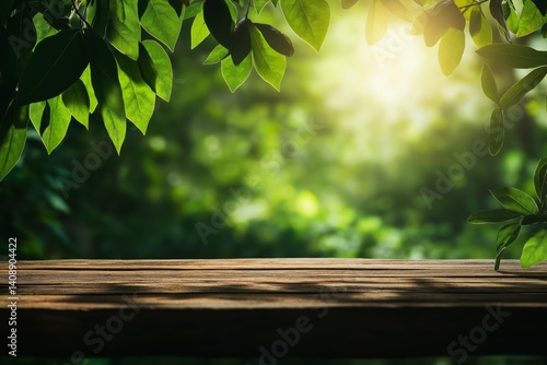 Obraz na płótnie Empty wooden table in front of blurred lush green forest with soft sunlight filtering through foliage and space for text. Concept of nature, tranquility, and eco-friendly presentation. w salonie