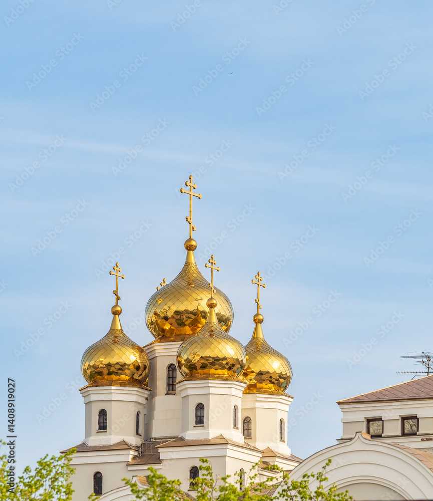 The golden domes of the Christian church in sunset light. The golden domes of the Christian church in sunset light.