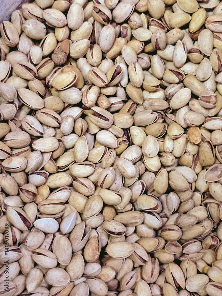 natural background of pistachios with nuts, top view. Pistachios in the peel
