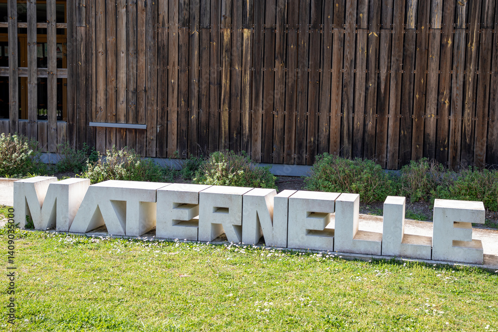 maternelle french text means kindergarten infant school on wall facade entrance building